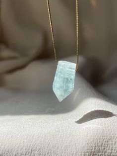 Intuitively Selected Aquamarine Necklace *Note: each stone is completely unique and one of a kind. You will receive a piece that is intuitively selected for you! Stone sizes vary from 15-35mm in length. The piece you see is not the piece you will receive, but one that is similar in shape and size - inclusions vary, each piece is intuitively selected for you upon ordering! Aquamarine embodies the Divine Feminine energy which fills our oceans, its Latin name translating to water of the sea. It is Aquamarine Pendant With Natural Stones, Aquamarine Pendant Jewelry With Natural Stones, Unique Sapphire Gemstone Necklace, Spiritual Aquamarine Gemstone Necklace, Minimalist Healing Jewelry With Stones, Divine Feminine Energy, The Divine Feminine, Aquamarine Pendant, Aquamarine Necklace