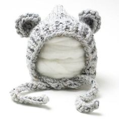 a crocheted bear hat is shown on a white background