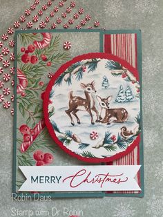 a christmas card with deer and pine branches