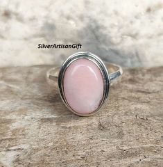 This gemstone encourages positive thinking, emotional balance, and a greater sense of overall well-being. Spiritual Awakening: Pink opal is associated with spiritual growth and awakening. It is believed to enhance intuition, psychic abilities, and spiritual insight. Gift Opal Ring Stamped 925, Spiritual Opal Ring Gift, Minimalist Sterling Silver Opal Ring, Pink Opal Rings As A Gift, Silver Pink Opal Ring Gift, Silver Pink Opal Ring For Gift, Spiritual Sterling Silver Opal Ring, Pink Sterling Silver Spiritual Rings, Spiritual Nickel-free Pink Jewelry