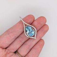 Santa Maria Aquamarines are rare and coveted gemstones. This gorgeous pendant showcases a large 8-carat pear-cut aquamarine set in a natural earth-mined diamond-accented pendant in 14k white gold. This pendant makes a lovely March birthstone gift for your loved ones! This pendant is made with solid 14k Gold and natural Earth mined SI / G-H diamonds. As listed, this pendant is ready to ship. If you're interested in purchasing this setting with a different center stone please message us! ***We als Luxury Teardrop Blue Topaz Jewelry, Luxury Teardrop Blue Topaz Jewelry With Diamond Accents, Teardrop Blue Topaz Jewelry With Diamond Accents, Pear-shaped Topaz Gemstone Jewelry, Marquise Aquamarine Gemstone Jewelry, Luxury Pear-shaped Blue Topaz Jewelry, Fine Jewelry Aquamarine Pendant, Marquise Aquamarine Jewelry For Gifts, Fine Jewelry Blue Topaz In Pear-shaped