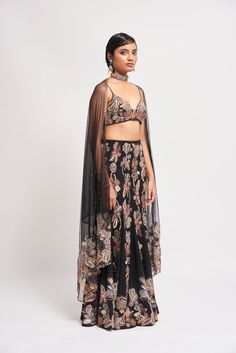 Kinfolk Black applique embellished georgette fish tail lehenga, bustier & tulle dupatta. From Aisha Rao's Kinfolk collection. DELIVERY TIMEPlease allow 6-8 weeks for your outfit to arrive. FABRIC DETAILSGeorgette Professional cleaning only. Embroidered Lehenga With Cape Sleeves In Organza, Organza Choli With Zari Work And Cape Sleeves, Organza Choli With Cape Sleeves And Zari Work, Embellished Lehenga With Cape Sleeves For Festivals, Festive Embellished Lehenga With Cape Sleeves, Festive Embroidered Lehenga With Cape Sleeves, Fitted Choli With Resham Embroidery And Cape Sleeves, Fitted Gown With Dupatta And Cape Sleeves, Organza Anarkali Choli With Cape Sleeves