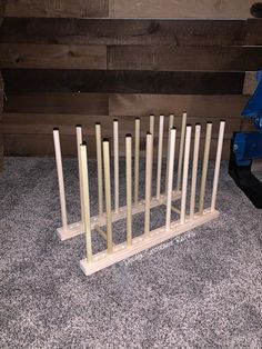 a group of wooden poles sitting on top of a floor