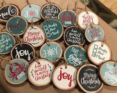 christmas ornaments are displayed on a table