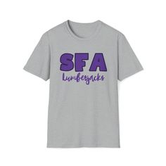 Gear up for a burst of school spirit with our SFA college shirt, the perfect attire to showcase your pride for Stephen F. Austin State University. Whether you're heading to class, cheering at games, or simply strolling around campus, this shirt is your go-to for displaying that unmistakable Lumberjack pride. MORE DETAILS: The unisex soft-style t-shirt puts a new spin on casual comfort. Made from very soft materials, this tee is 100% cotton for solid colors. Heather colors and sports grey include Athletic Heather Graphic T-shirt For College, Fan Apparel T-shirt For Athletic Heather, Soft-washed College T-shirt Fan Apparel, Gray Cotton T-shirt With School Spirit, Sfa Lumberjacks, College Fan Apparel T-shirt Short Sleeve, College Shirts, Lumberjack, School Spirit