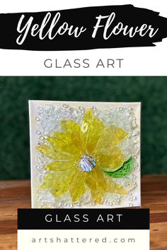 the yellow flower glass art is displayed on a table with text overlaying it