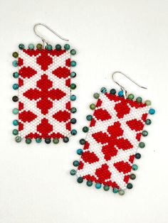 Hand beaded red and white earrings with turquoise details Red Beaded Earrings With Large Beads, Red Beaded Drop Earrings With Large Beads, White Round Bead Earrings For Beach, Turquoise Earrings With Large Beads For Gifts, White Handwoven Drop Earrings, Red Handwoven Beach Jewelry, Red Bohemian Rectangular Earrings, Bohemian Red Rectangular Earrings, Red Artisan Handwoven Jewelry