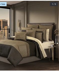 a bed room with a neatly made bed and a cityscape in the background