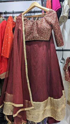 Maroon & Gold color Lehenga set for women! This outfit can Be made in ANY COLOR. Please send us a convo if you want this in a different color.  Blouse: Heavy thread and sequins work on net Lehenga: Art Raw Silk Dupatta: Soft Net   MEAUREMENTS & CUSTOMIZATIONS   For custom sizing please include the below measurements in the the notes.  * Chest size: * Waist size: * Blouse Length: * Bicep: * Arm-hole: * Sleeve Length: * Front Neck Depth: * Back-Neck Depth: * Skirt Waist: * Skirt Length:   SHIPPING & HANDLING   Since all our orders are custom made, we require 1-3 weeks of processing time.  Please leave your contact number in notes section while placing the order OR message us later. The shipping companies need your contact number incase they need to contact you during delivery.  Our shop is b Anarkali Floor-length Choli For Traditional Ceremonies, Red Floor-length Festive Sets, Semi-stitched Long Art Silk Sets, Long Choli With Pallu For Eid, Festive Long Anarkali Choli, Full Length Zari Work Sets For Diwali, Long Semi-stitched Choli For Festive Occasions, Traditional Floor-length Choli For Celebrations, Art Silk Gown For Traditional Ceremonies