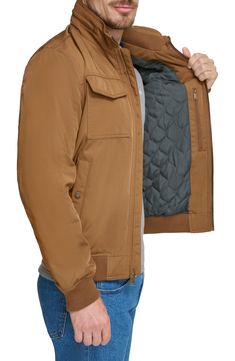 stay cozy in style when you wear this must-have jacket that's designed with a nifty packable hood. 30" length (size M) Packable hood Long sleeves Front zip closure Chest patch pockets Front snap pockets Quilted lining 100% polyester Machine wash, tumble dry Imported Model stats: 6'0" height; 32" waist. Model is wearing size M. Brown Fits, Man Up, Nordstrom Store, Active Women, Stay Cozy, Boy's Clothing, In Style, Nordstrom Rack, Clothing And Shoes