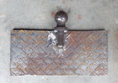 an old iron door handle on the side of a building