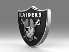 a black and silver shield with the oakland football team logo on it's side