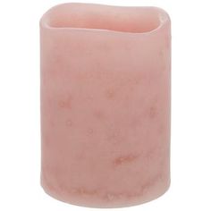 a pink candle that is on a white background