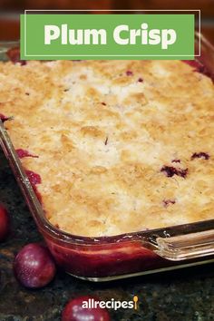 a casserole dish with plum crisp in it and the words plum crisp above it