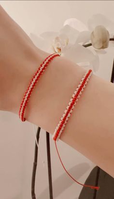 To make sure that our bracelet is right for you please send us a message specifying age group and gender. Example: adult-male or infant. Also let us know which pattern you like (Red/white cord in the middle). We can also make them all white or all red.  Our Martisor Bracelets are made of wax cord. Wear this bracelet on your left wrist to keep you safe and bring you good luck. The bracelet is suitable for men, women and teenagers. Our products come wrapped in brown wrapping paper and tied with jute rope. White Resizable Braided Friendship Bracelets, Casual Red Braided Bracelets As Gift, Casual Red Braided Bracelets For Gift, Handmade Red Braided Friendship Bracelets, Handmade Red Braided Bracelets For Friendship, Handmade Red Friendship Bracelets, Red Casual Wristband As Gift, Casual Red Wristband As Gift, Casual Red Wristband For Gift