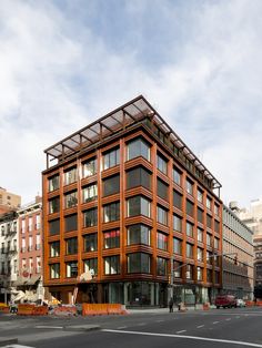 a large wooden building sitting on the side of a road