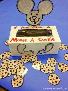 a cardboard box with cookies in it and a mouse cut out on the side that says if you give a mouse a cookie