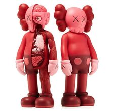 two red plastic figurines are standing next to each other