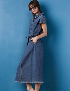 The Weekend Denim Midi Dress is always ready for fun, with it's adorable cropped sleeves, tie-waist, and frayed hem detail. The cover model is 5'7" wearing size small Fabric: 100% Cotton Length: 48 1/2" from shoulder to longest point Cotton Denim Dress With Frayed Hem And Short Sleeves, Indigo Denim Short Sleeve Dress With Pockets, Indigo Short Sleeve Denim Dress, Indigo Denim Dress With Pockets And Short Sleeves, Short Sleeve Dark Wash Denim Jumpsuit, Summer Short Sleeve Belted Denim Dress, Summer Denim Dress With Belt And Short Sleeves, Blue Denim Jumpsuit With Frayed Hem For Spring, Spring Belted Denim Jumpsuit