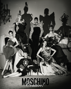 black and white photograph of models in evening gowns posing for moschino couture