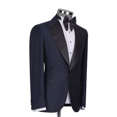 Package Includes: 1 x Jacket - 1 x Waistcoat - 1 x Pant

Upgrade your formal attire with our Dark Navy Blue Tuxedo, a blend of modern style and classic refinement. Expertly tailored for a flattering fit, this tuxedo promises both comfort and a sleek silhouette. The deep navy color adds a contemporary flair to the traditional black, ideal for weddings, galas, and any elegant affair. Constructed from high-quality fabrics, it features a satin shawl lapel and coordinated trousers, radiating luxury and elegance.

 	Fabric: 120s 
 	Lining Fabric: Silk
 	Pattern: Plain
 	Buttons: Black Fabric
 	Construction: Half Canvas
 	Seasonality: All Season
 	Jacket: Peak Lapel, 2 Flap Pockets, Single Button Closure
 	Waistcoat: Shawl Lapel 3 Buttons Closure
 	Trouser: Grey Flat front, 2 Back Pockets, Zip Cl Luxury Single Breasted Outerwear For Black Tie, Luxury Single-breasted Outerwear For Black Tie, Black Tie Tuxedo Blazer With Hidden Button Closure, Tuxedo Blazer With Hidden Button Closure For Black Tie, Tailored Tuxedo Outerwear For Black Tie Events, Timeless Long Sleeve Tuxedo For Evening, Fitted Outerwear With Lapel Collar For Black Tie Event, Black Tie Tuxedo Style Single-breasted Outerwear, Elegant Black Tie Outerwear With Lapel Collar