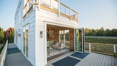 a white house with a deck and patio