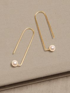 LUSTROUS PEARL COLLECTION: Every pearl is a natural wonder.  With their expansive variety of shapes, colorations, and sizes, our hand-crafted jewelry pairs gorgeous hand-picked pearls with brass or gold-plated brass chains and fittings for a collecti Gold Minimalist Pearl Earrings For Anniversary, Minimalist Gold Pearl Earrings For Anniversary, Modern Gold Pearl Earrings With Pearl Charm, Elegant Round Brass Pearl Earrings, Modern Handmade Pearl Jewelry, Elegant Brass Pearl Earrings, Modern Akoya Pearl Earrings In Gold, Handmade Classic Yellow Gold Pearl Earrings, Classic Handmade Yellow Gold Pearl Earrings