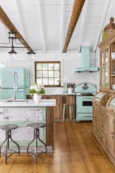 an instagram page for country livingmag shows the kitchen and dining room in pastel colors