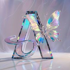 a glass sculpture with a butterfly on it's back and the letter a behind it