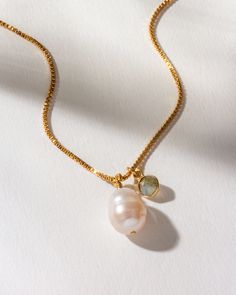 The organic shape of the pearl provides a unique focal point that is both modern and classic, making it a versatile addition to any jewelry collection. The necklace is 18 inches long and has a 3-inch extender, allowing you to adjust it to your desired fit. The combination of freshwater pearl and labradorite charm brings a sense of classic, timeless vibes to any outfit. Whether dressing up for a special occasion or adding a touch of charm to your daily attire, this necklace is the perfect choice Simple Sea Love Necklace Everyday, Ocean Necklace Simple, Cheap Minimalist Summer Jewelry, Modern Gold Pearl Necklace With Pendant, Modern Pearl Drop Pendant Necklace, Adjustable Baroque Pearl Pendant Jewelry, Adjustable Baroque Pearl Jewelry With Pearl Pendant, Modern Pearl Necklaces As A Gift, Modern Pearl Jewelry With Adjustable Chain