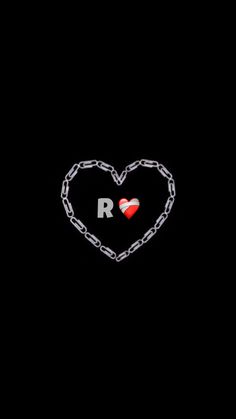 a heart with the letter r on it is chained to a chain that has been placed in the shape of a heart