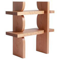 a wooden shelf that has two shelves on it