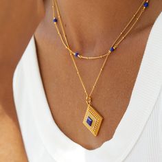 This stunning Lapis Lazuli Cube Hollow Necklace exudes vintage charm and refinement. With its delicate hollow design, it is a stylish and versatile addition to any jewelry collection. Material: 925 sterling silver plated with 18K gold, 5A zirconMain stone: natural lapis lazuliPendant: 2*2cmChain length: 46cm Elegant Sapphire Color Gold Plated Necklace, Elegant Sapphire Color Gold-plated Necklace, Gold Necklace With Detachable Cubic Zirconia Pendant, Elegant Blue Gold-plated Charm Necklace, Elegant Gold Plated Birthstone Charm Necklaces, Elegant Gold Plated Birthstone Charm Necklace, Hollow Design, Ring Bracelet, Earring Necklace