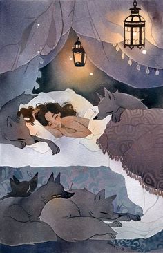 a woman laying in bed next to two wolfs under a light hanging from a lantern