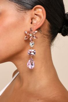 Celebrate all things sweet and sparkly with the Lulus Glittering Blooms Pink Multi Rhinestone Flower Drop Earrings! These darling earrings are composed of shiny, gold-toned metal that supports a variety of sparkling pink-toned rhinestones. Posts boast sweet floral arrangements of stones and support drop-style chains of multicolored rhinestones that finish with teardrop-shaped pendants. Post backs. 3. 75" Long And 1. 55" Wide. 50% Brass, 50% Glass. Imported. Lulus | Glittering Blooms Pink Multi R Flower Drop Earrings, Lulu Fashion, Statement Drop Earrings, Rhinestone Flower, Sweet Floral, Earrings Drop, Classic Jewelry, Pink Rhinestones, Rhinestone Earrings