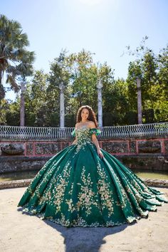 The fabric in this Princesa by Ariana Vara Quinceanera dress is Novelty Glitter, Embroidered Lace, Bead, Stone Accents . Separate Arm Ruffle Bands, Detachable Shoulder Straps, Cape, Back Modesty Panel & Hairpiece Included Charro Quinceanera Dresses Green, Quinceanera Dresses Dark Green, Emerald Green And Gold Quince Dress, Green And Gold Quinceanera Dresses, Emerald Green 15 Dress, Quinceanera Green, Emerald Green Quince Dress, Dark Green Quinceanera Dresses, Gold Quince Dress