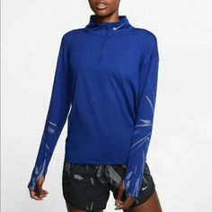 In New Condition. Functional Blue Tops For Winter, Functional Blue Winter Tops, Nike Long Sleeve Running Top, Nike Blue Sportswear Top, Functional Blue Go-dry Tops, Blue Technical Long Sleeve Top, Blue Functional Go-dry Tops, Technical Blue Long Sleeve Tops, Blue Winter Workout Tops