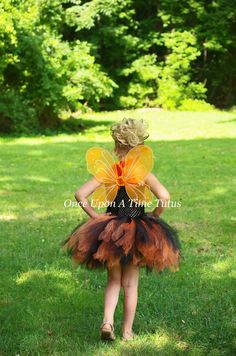 Orange and Black Tutu Dress This gorgeous orange & black tutu on an unlined black top is so versatile! Wear with a butterfly Halloween costume, use a autumn photo prop, first birthday party outfit, or just for play! Sizes and Lengths: 0-6 Months 6 Inch Length 6-12 Months 7 Inch Length 12M-2T 8 Inch Length 3T - 4T 11 Inch Length 5 - 6 12 Inch Length 7 - 8 14 Inch Length 10-12 15 Inch Length Tutu will be shipped safely in a box to prevent crushing. Perfect for gift giving, dress up, photo prop Black Halloween Costumes For Dress-up, Fitted Black Costume For Dress-up, Fitted Tutu Dress For Halloween Dress-up, Fitted Halloween Tutu Dress Costume, Black Fitted Tutu Dress For Dress-up, Fitted Black Tutu Dress For Dress-up, Black Tulle Tutu Dress For Costume Party, First Birthday Party Outfit, Black Tutu Dress