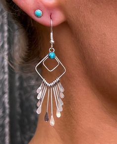 Sterling silver lightweight turquoise geometric earrings. These lightweight drop earrings feature a beautiful turquoise stone accent and beautiful sterling silver fringes that move independently and make a beautiful statement as you wear them. These earrings are lovely worn alone, but also pair beautifully with other stud and cuff earrings. Please make sure to check out my other listings to find the perfect cuff and stud earrings to compliment your look. https://www.etsy.com/shop/HatchTraders2 Turquoise Sterling Silver Dangle Chandelier Earrings, Turquoise Sterling Silver Chandelier Earrings, Jewelry Delicate, Earrings Geometric, Southwestern Jewelry, Delicate Earrings, Etsy Earrings Dangle, Earrings Boho, Fringe Earrings