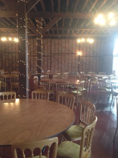 the inside of a restaurant with tables and chairs