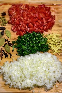 chopped up vegetables and spices on a cutting board