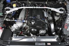 the engine compartment of a car with its hood open