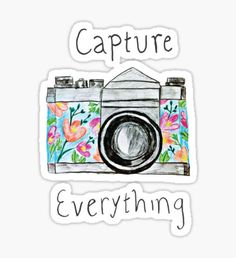 a camera with the words capture everything sticker on it's front and side