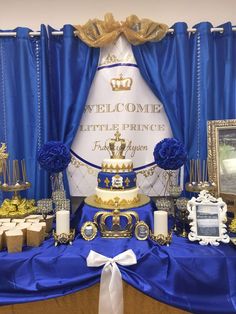 a blue and white table topped with a cake