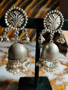 Contact for bulk order+91-9352395515 925 Silver earring, Fancy Earring, Trending Earrings, Jhumka, Gift for her, Perfect for any Occasion, Best for gift, Jewelry, silver,  Handmade Earring Material- Silver, Semi precious stone Weight-39Grams Colour-silver Category - Drop dangle Earrings Gift Wrapping Available  Elegant Sterling Silver Earrings | Timeless Beauty Add a touch of elegance to your ensemble with these exquisite sterling silver earrings. Expertly crafted from high-quality 925 sterling Handmade Silver Temple Jewelry Chandelier Earrings, Silver Temple Jewelry Chandelier Earrings With Latkans, Elegant Silver Danglers For Navratri, Traditional Silver Chandelier Earrings For Festive Occasions, Traditional Dangle Pearl Earrings For Anniversary, Silver Pearl Earrings With Intricate Design For Celebrations, Silver Pearl Drop Earrings With Intricate Design, Elegant Silver Metal Jhumkas, Silver Chandelier Earrings With Intricate Design For Festive Occasions