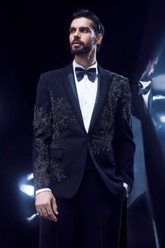 Black tuxedo with sequin, bead, cutdana embellishment. Paired with pant. - Aza Fashions Fitted Tuxedo For Festive Party Wear, Embellished Fitted Tuxedo For Wedding, Elegant Fitted Tuxedo For Festive Occasions, Embellished Tailored Suits For Party, Embellished Tailored Suits For Evening, Tailored Evening Suit With Sequins, Tailored Embellished Evening Suits, Evening Embellished Tailored Suits, Evening Tailored Embellished Suits