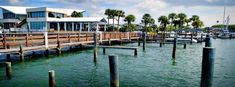 there are many boats docked in the water at this dock house and boatyards