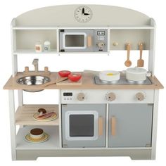 a toy kitchen set with an oven, sink and microwave on the top shelf in front of it