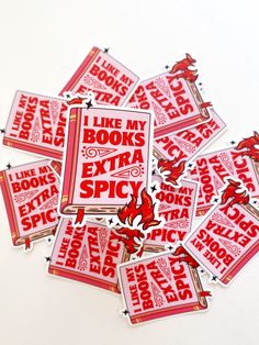 red and white stickers with the words like my books extra spicy written on them