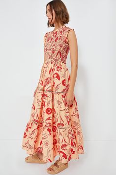 Oliphant's vacation-ready pieces are characterized by breezy silhouettes and vibrant colors.We are loving this breezy, feminine Audubon Red Sleeveless Maxi Dress. Featuring an adorable ruffle neckline and sleeves, a comfortable smocked bodice, and a tiered skirt, this easy pull-on style can be dressed up or dressed down for any occasion. Pair with platform espadrilles for a summer dinner party, or with sandals for strolling around town! Ruffle neckline Sleeveless Ruffle armholes Smocked bodice G Red Smocked Dress For Vacation In Spring, Spring Vacation Red Smocked Dress, Red Smocked Dress For Spring Vacation, Red Ruched Smocked Dress For Vacation, Red Sleeveless Smocked Dress, Red Smocked Dress With Smocked Back For Vacation, Red Sleeveless Dress With Smocked Bodice, Red Sleeveless Smocked Dress For Beach, Sleeveless Smocked Dress With Gathered Neckline For Beach